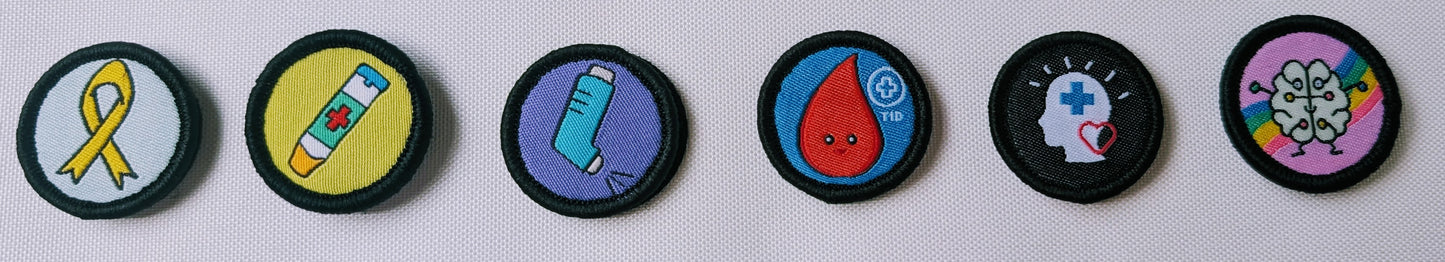 Set of colorful circular badges with various symbols on a white background